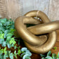 GOLD LINKED WOOD KNOT DECOR