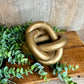 GOLD LINKED WOOD KNOT DECOR