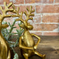 GOLD SITTING HOLDING HANDS REINDEER